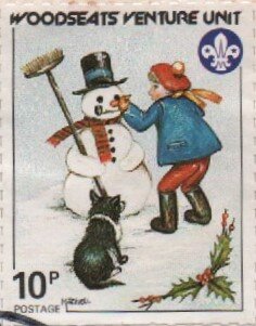 Child putting nose on Snowman