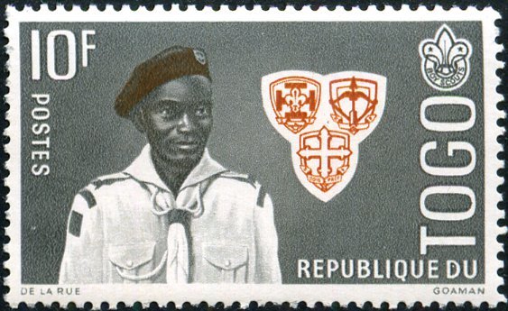Scout with troop emblems