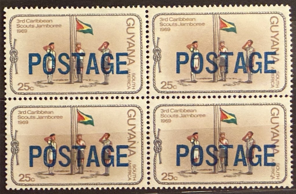 25 c block of four — blue POSTAGE overprint