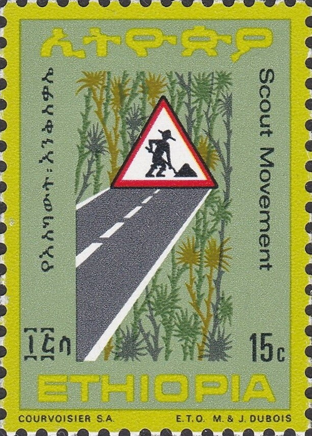 Road sign with a Scout digging